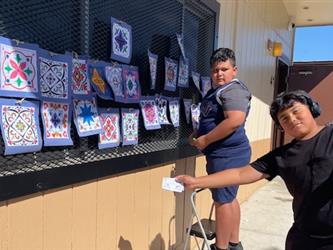 Students hanging up work